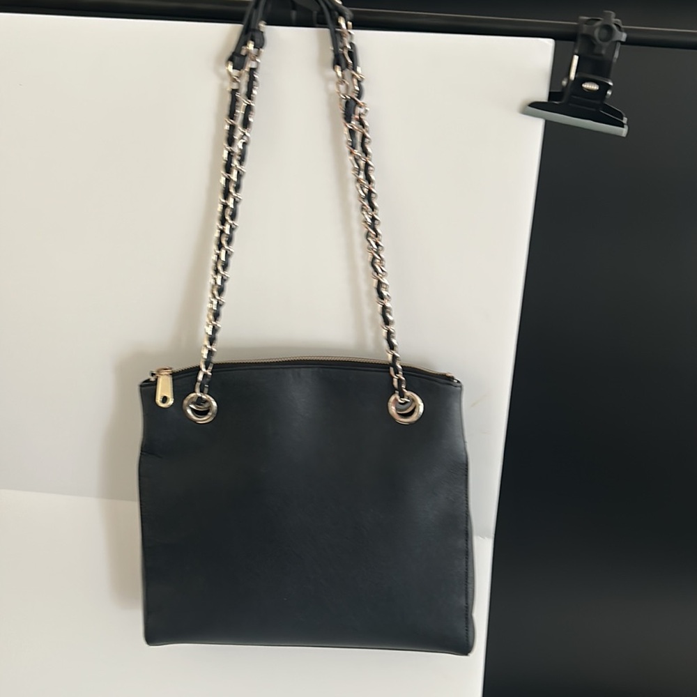 Black DKNY shoulder bag with chain handles.